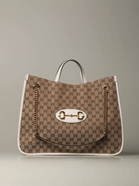 gucci blanca|white Gucci shopping bag.